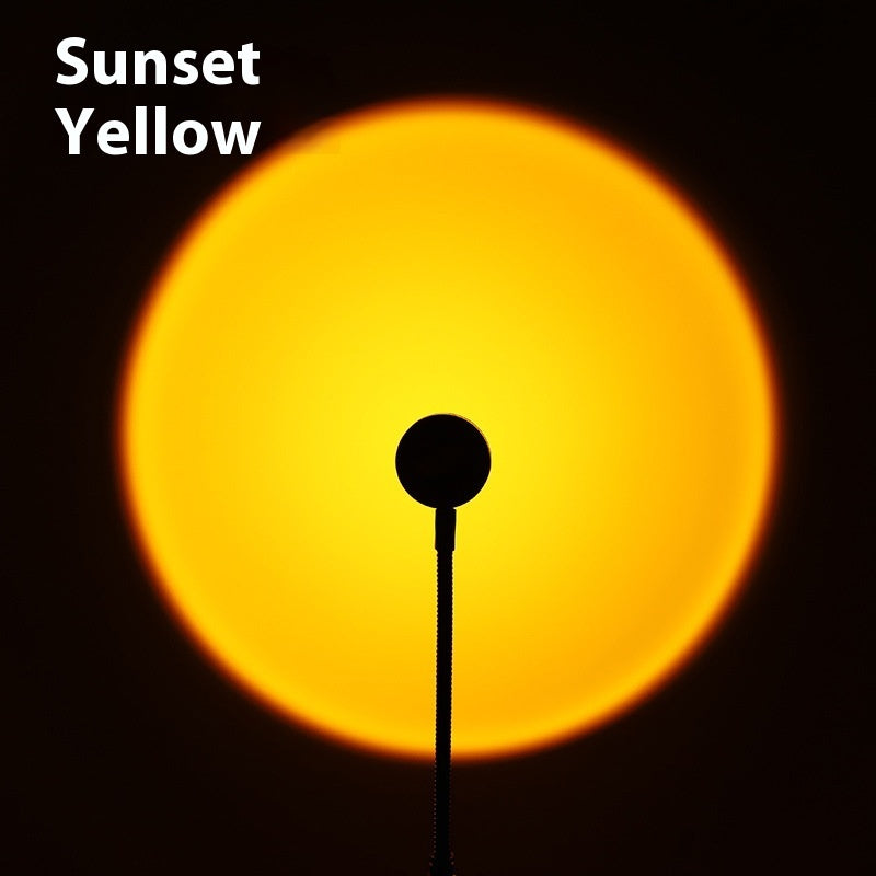 USB Sunset Projection Lamp showcasing Sunset Yellow light effect in a dark setting.