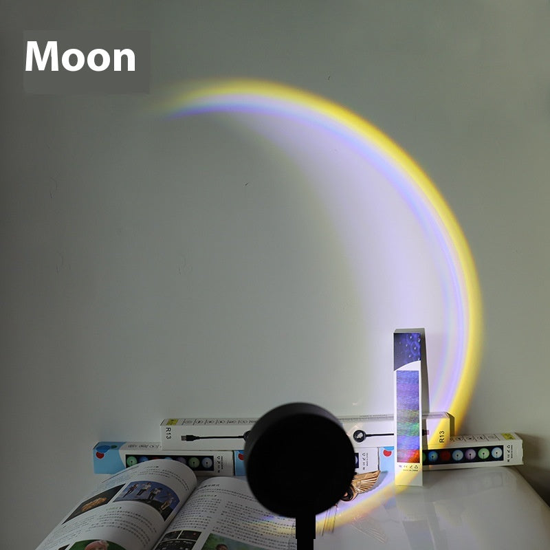 USB Sunset Projection Lamp casting a moonlight glow with colorful hues on a surface.